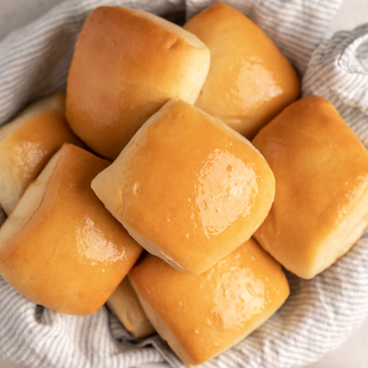 A small bowl filled with Texas Roadhouse copycat rolls.